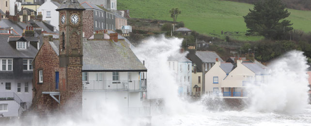 Waves breaking over Cornwall village