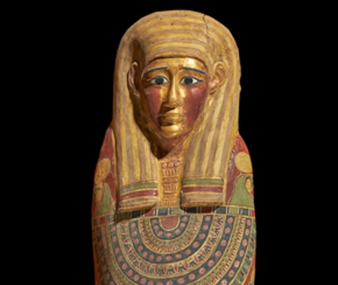 Image of the top half of the mummy's colourful coffin. 